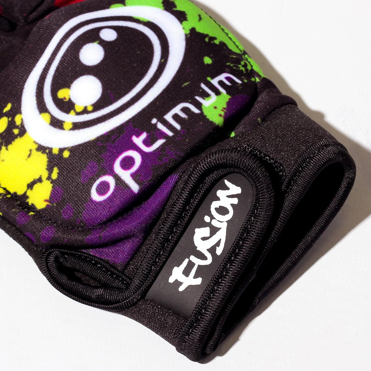Close-up of black Optimum Fusion half-finger hockey glove with paint-splatter print, white logo and Fusion cuff - Optimum
