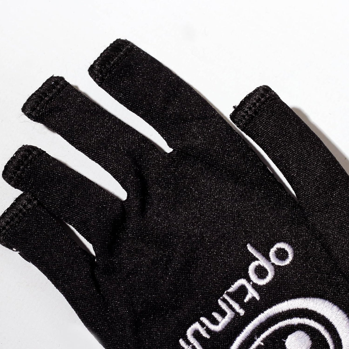 Close-up of black Optimum Stik Mits fingerless glove showing cut-off fingertips and white logo on white - Optimum